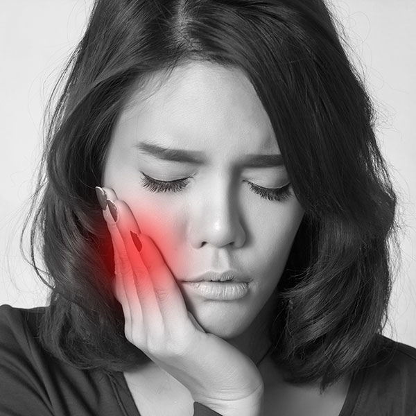 Woman with mouth pain