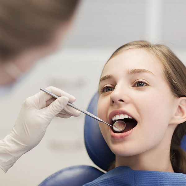 Girl receiving Dental treatment